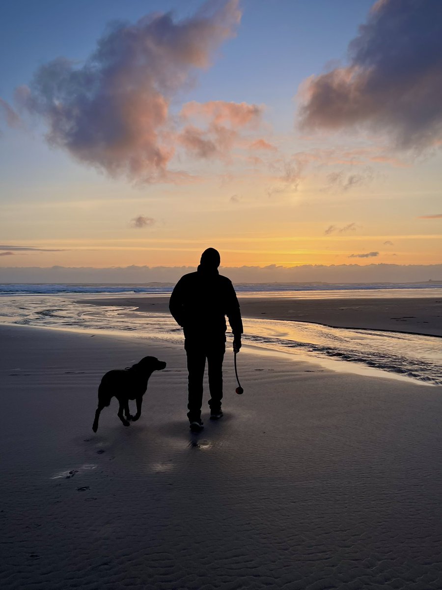 20th April, 5.55am.  
#Bamburgh
#Northumberland 
It was cold 🥶 
I do like this pic even if Harley’s a little blurred.