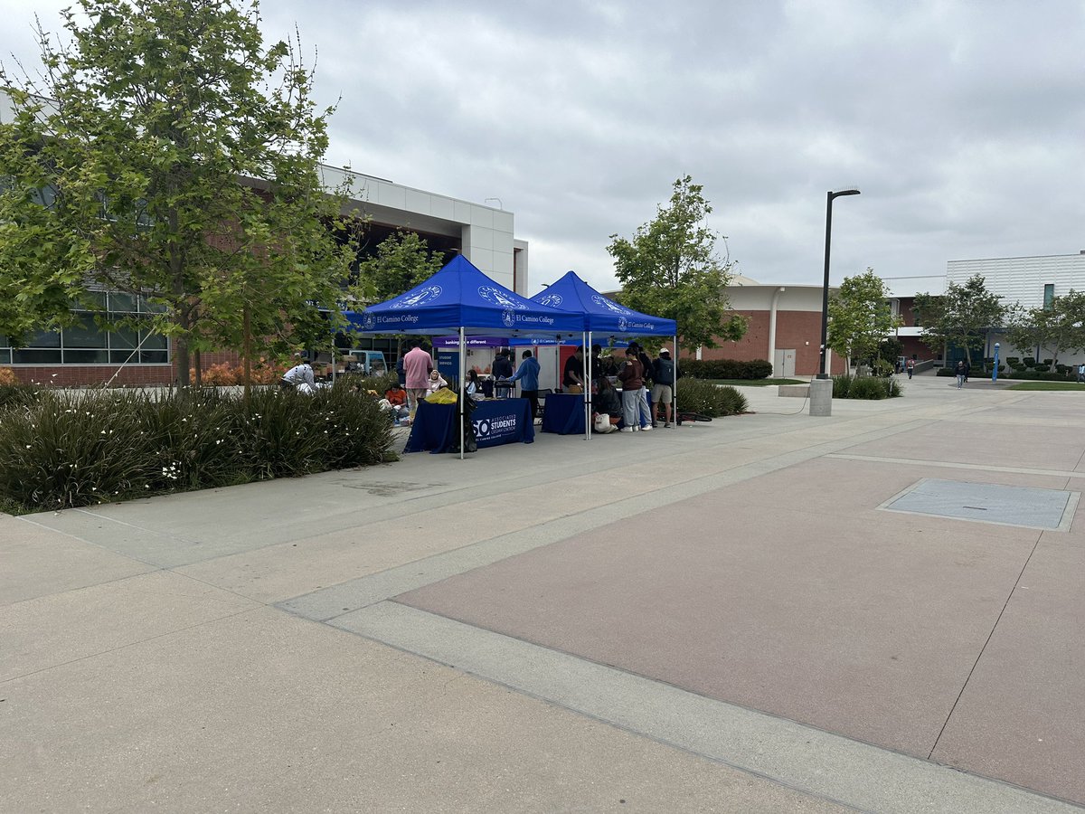 The <a href="/elcamino_aso/">El Camino ASO</a> holds an event in front of the student service center with students decorating signs while music plays in the background. #ECCUnion