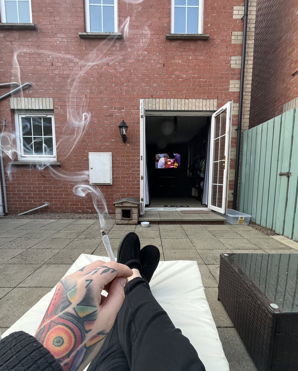 absolutely loving the way i can watch tv from my garden while i’m smoking a joint 🤣🙌🏻