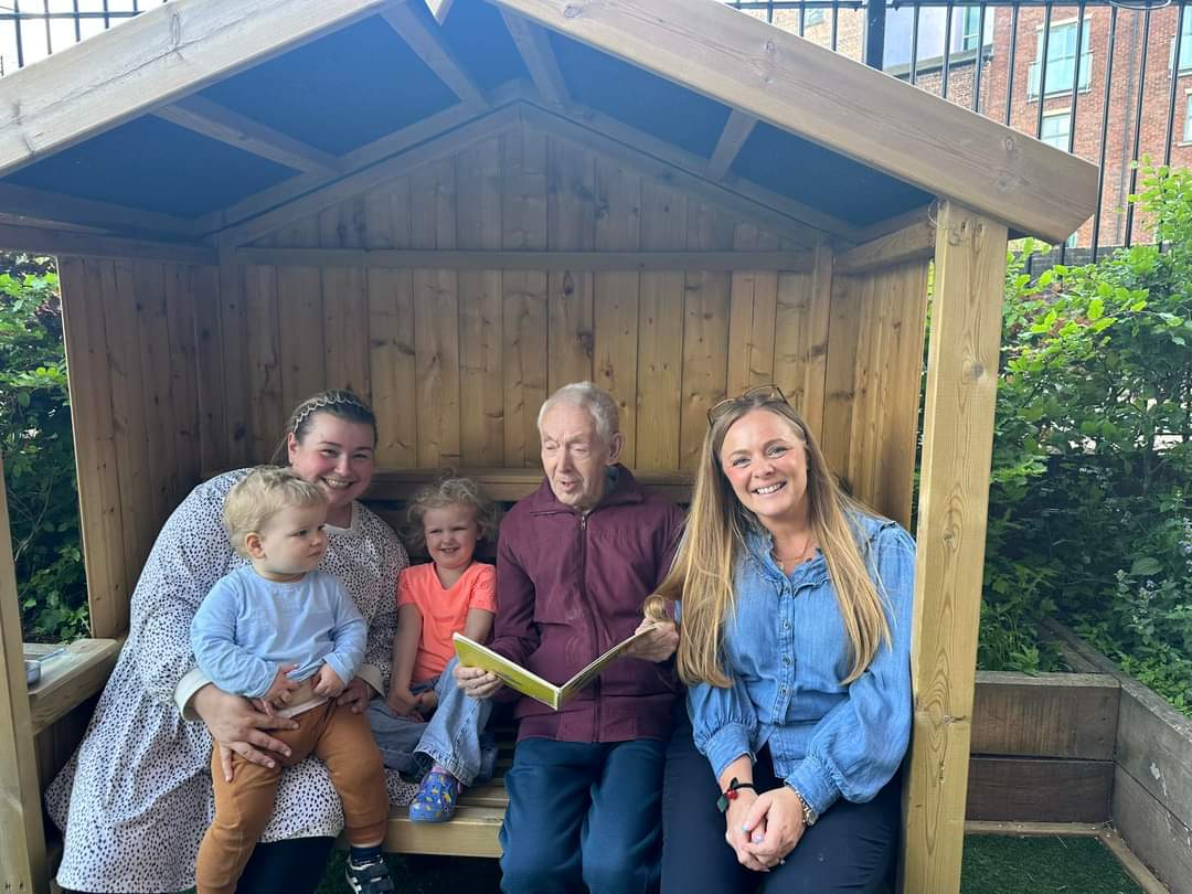 Garden storytime with our intergenerational champion, Bill. He visits the children everyday - such a great team member! @AlisonMPeacock @BelongVillages @Annagoge #earlyyears