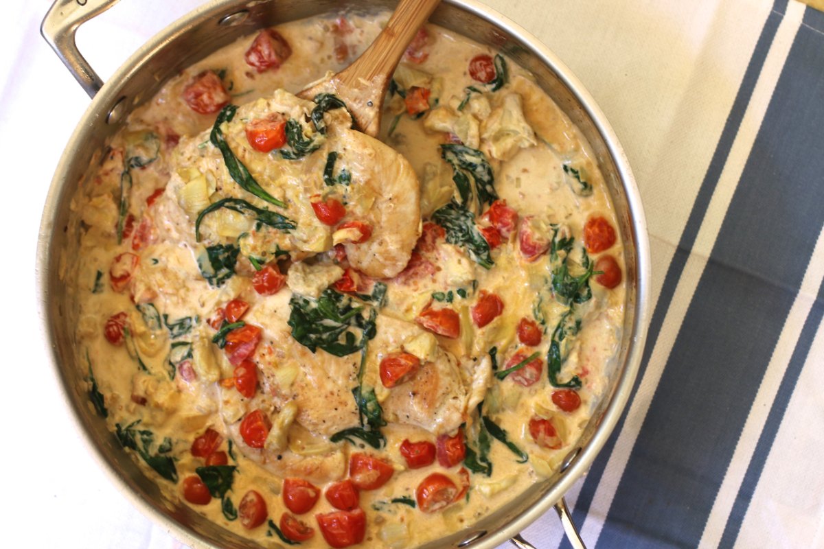 Everyone who makes this delicious recipe swears it gets them laid: Chicken with Artichokes, Spinach, and Cherry Tomatoes. Available in Eat Happy Cookbook amzn.to/2gBvgXt #GlutenFree