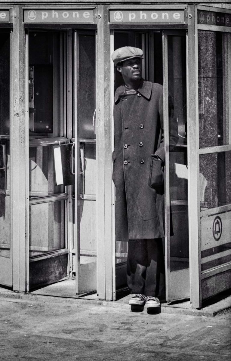 Thanks to Arthur Furst for this one! Staying out of the cold winds on Tremont. Phone booths next to the Park Street Station. 1970s.