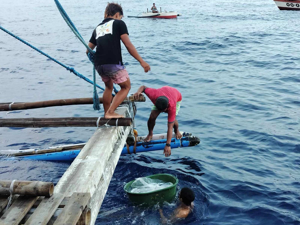 LOOK: Atin Ito coalition's advance team that left Masinloc town a day before its civilian-led supply mission started 'successfully breached China's imposing blockade at Bajo de Masinloc' and were able to deliver 1,000 liters of diesel and 200 food packs there. | 📸: Atin Ito via