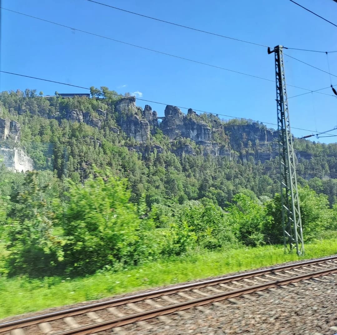 Absolutely stunning views as we pass south of Dresden on the European Sleeper. 
Check out the buildings and bridge in the hill/cliff!
The journey to @CzechDreamin continues. 
#cd24