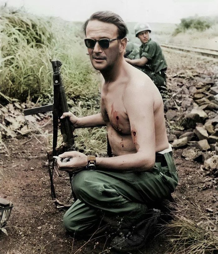 Swedish major Eric Bonde smoking a cigarette after being ambushed and shot twice, Congo, 1961.