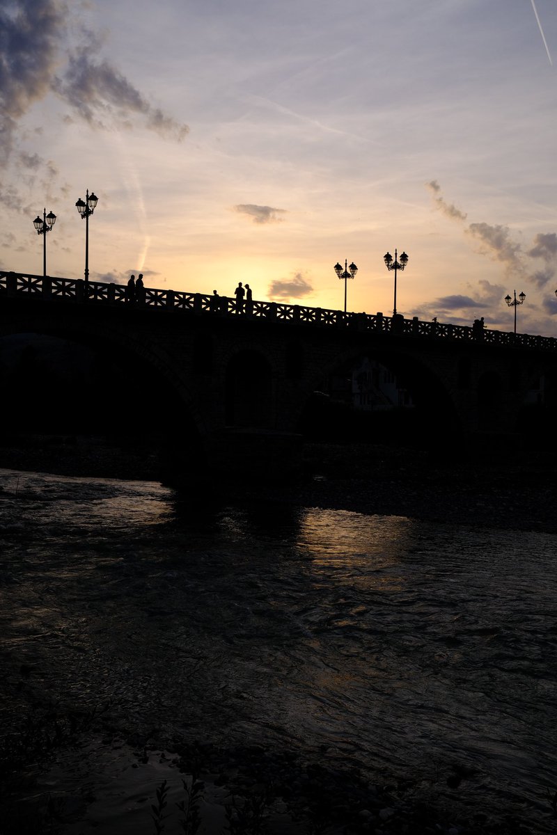 People on a bridge at sunset. Was lovely stood by the river, watching the world go by on the bridge above. Berat, Albania Fuji XPro3 and Velvia