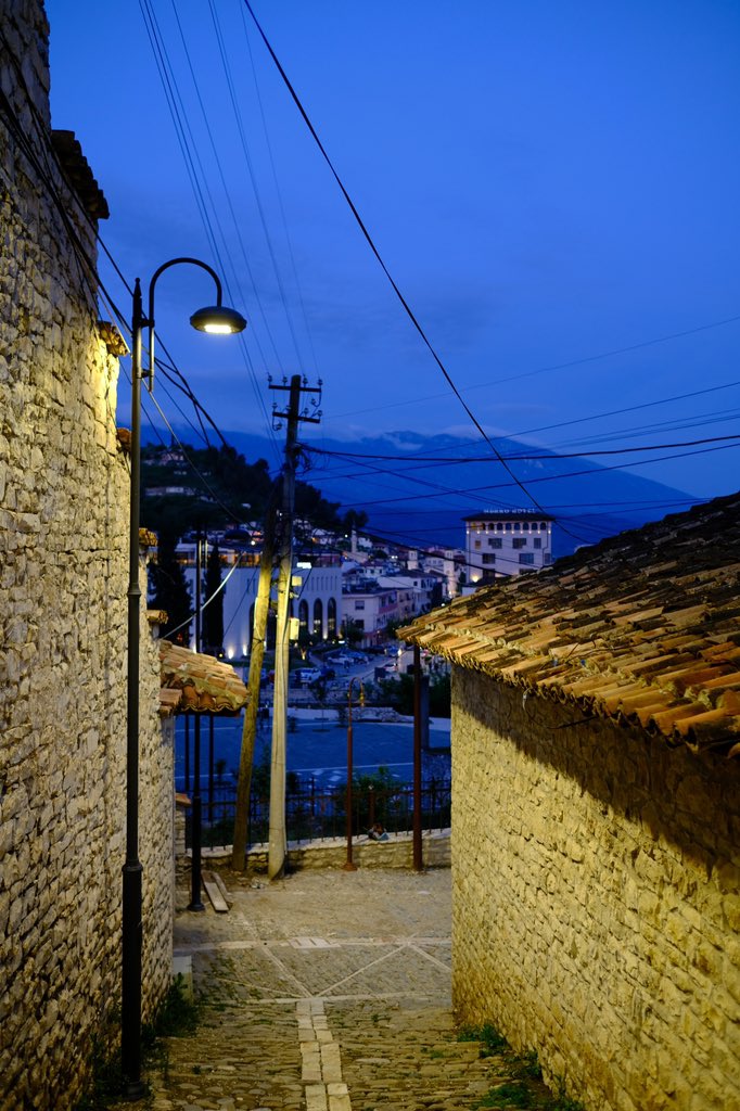 They do like telegraph wires here. Love the glow from the streetlamp on the stone buildings, with the mountains beyond. And telegraph wires. Lots of those. Berat, Albania. Fuji XPro3 and Velvia