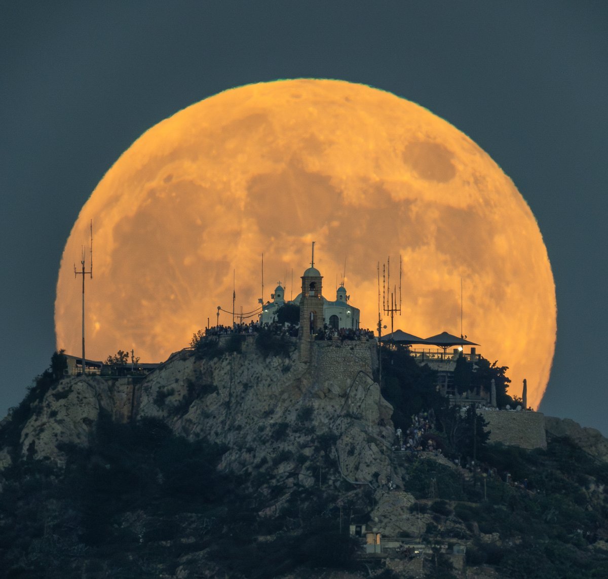 “Hello! The Full Moon rises behind the Church of St.George at Mount Lycabettus, Athens.” 📷 Sony a7 III | 1250mm | ƒ/14 | 1/100ss | ISO 2000 | Skywatcher Skymax 90 👉 Photo by Babis Kotsiotas 📍 Planned with PhotoPills: photopills.com