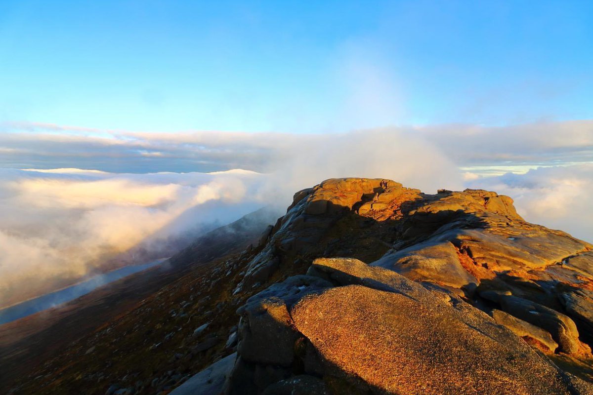 On top of Binnian as the sun behind me lifts up above the clouds! #beautiful #sunrise #mournes #NorthernIreland