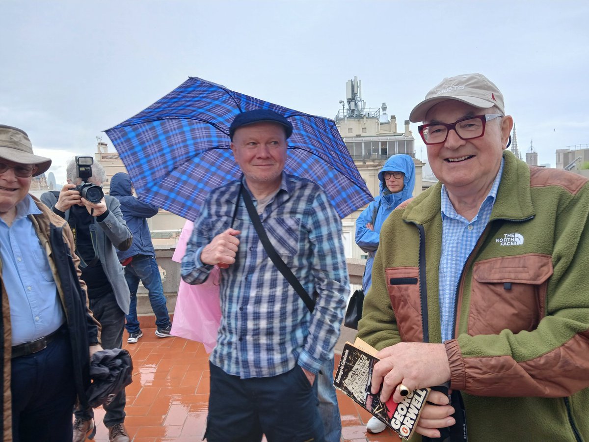 On the roof of the Poliarama yesterday with Richard Blair holding the book by his father, who defended the POUM headquarters across La Rambla from here as a sniper. Orwell spent four days on the roof. We last four minutes before the rain drove us downstairs.With @Orwell_Society