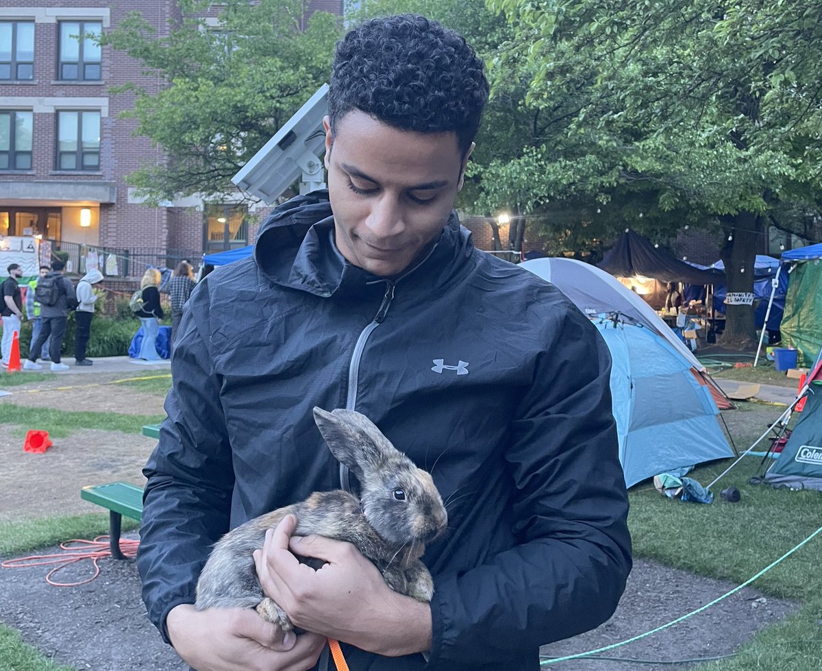 this was the last picture i took at the encampment before the chicago police department destroyed it. my friend samir with the encampment bunny