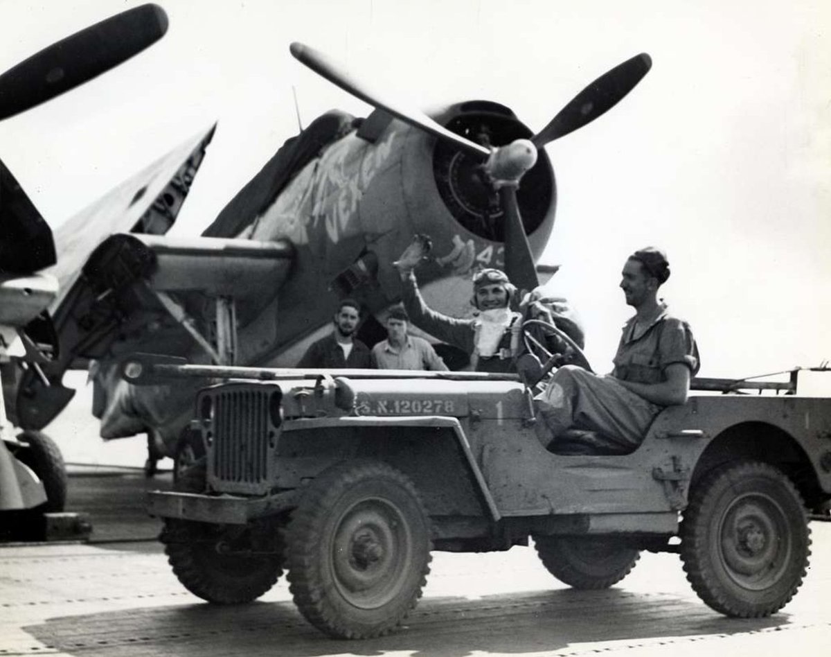 Lietenant Louis L. Bangs hands out gifts as 'Santa Claus' aboard the USS Enterprise (CV-6) on December 25, 1943. A cool Grumman TBF-1 Avenger from the Torpedo Squadron 6 (VT-6) looming! Have a great Thursday! ................... 📸 Unknown #jeep #jeeplife #legendary1941 #history