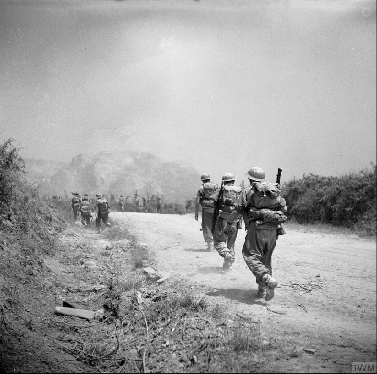 Today in 1944, British troops of 6th Battalion, Royal Inniskilling Fusiliers march along a dusty road towards Monte Cassino, as the artillery of Eighth Army bombards Monastery Hill. Photo: Sergeant Loughlin, @I_W_M NA 15059
