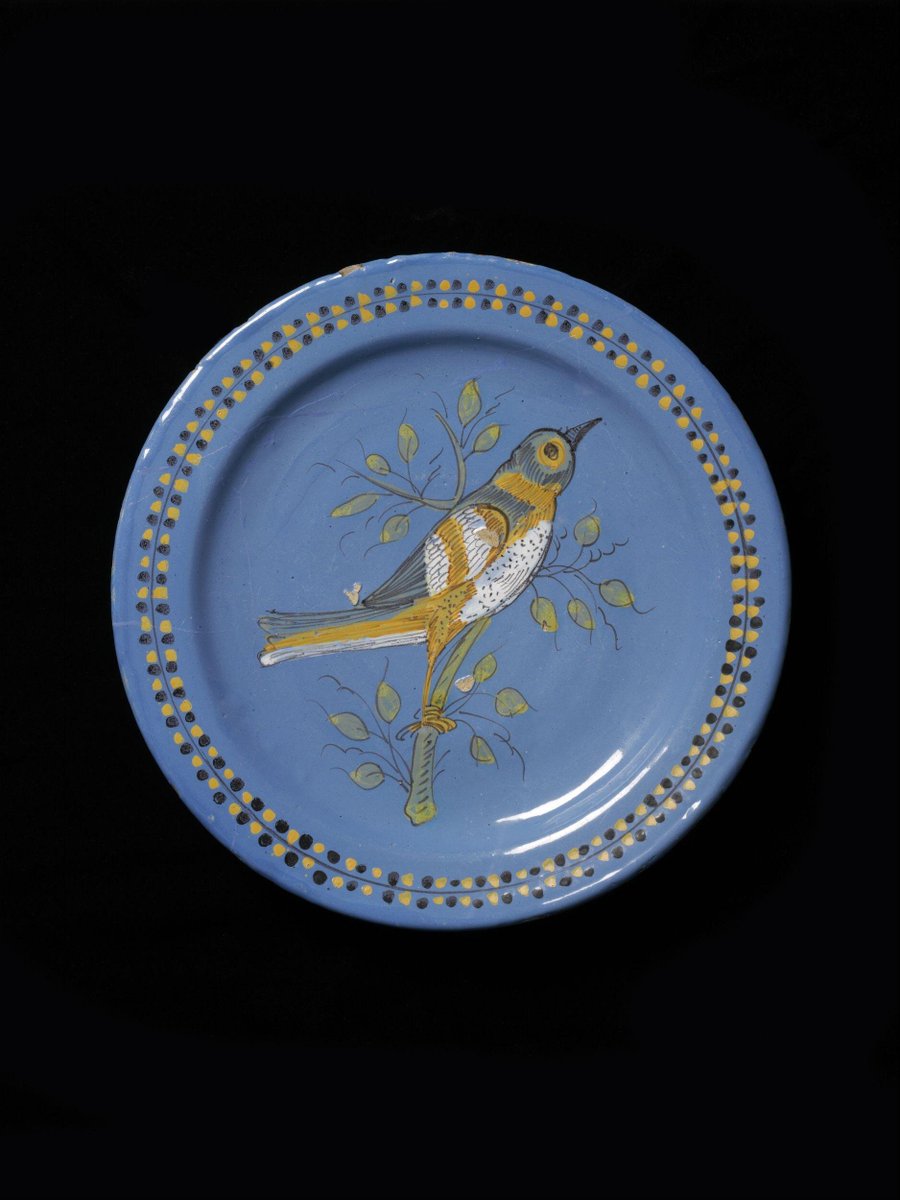 Dish depicting a bird on a branch on a blue ground, Netherlands, 1600-50 (V&A Museum, London)