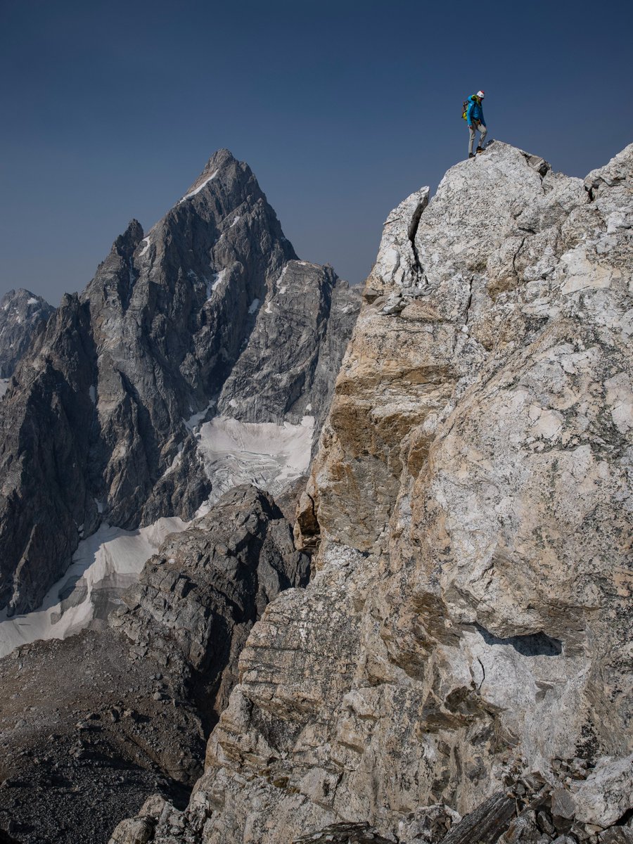 Beautiful capture by #CanonExplorerOfLight @jimkchin | '@conrad_anker on the Grand Traverse with the north face of The Grand Teton in the background, Grand Teton National Park, WY.' 📸 #Canon EOS R5 Lens: EF 24-70mm f/2.8L II USM