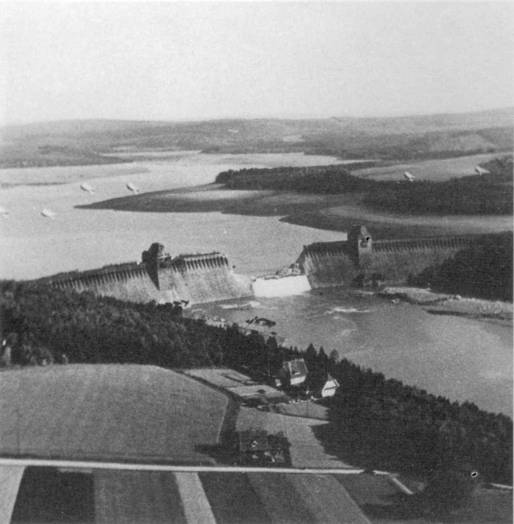 17 May 1943. Operation Chastise. Post-strike reconnaissance photographs show the breach of the Möhne Dam in the Ruhr Valley. The gap is 250 feet wide and 72 feet deep.