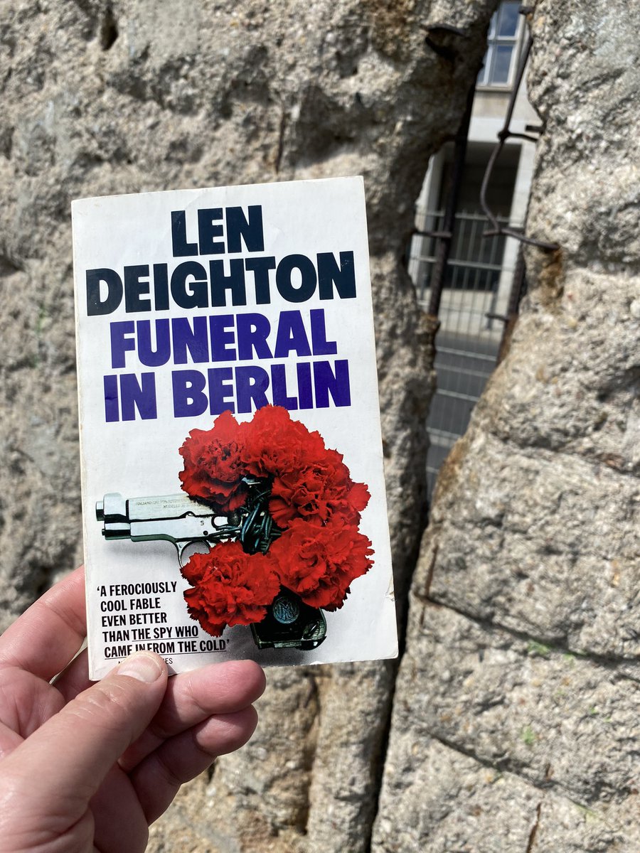 Me reading Len Deighton’s FUNERAL IN BERLIN, near an old section of the Berlin Wall.