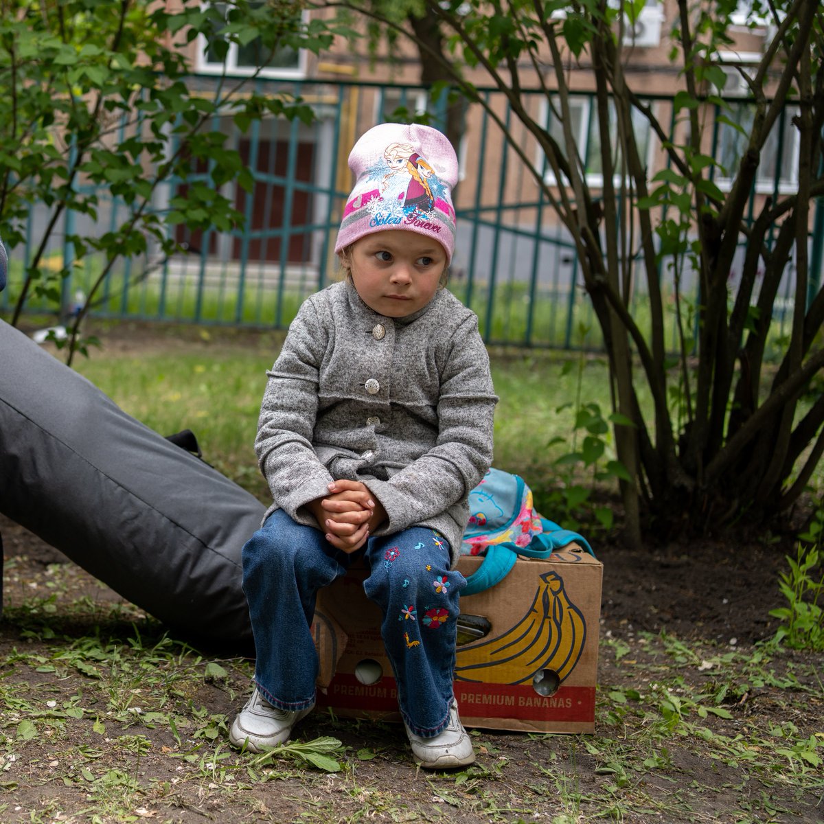 This little girl has left the life she knew behind. Last night, her family was hiding from shelling in Zakharivka, Kharkiv region. Today, they're in #Kharkiv, having left everything to save their children's lives. Childhood should not be like this.