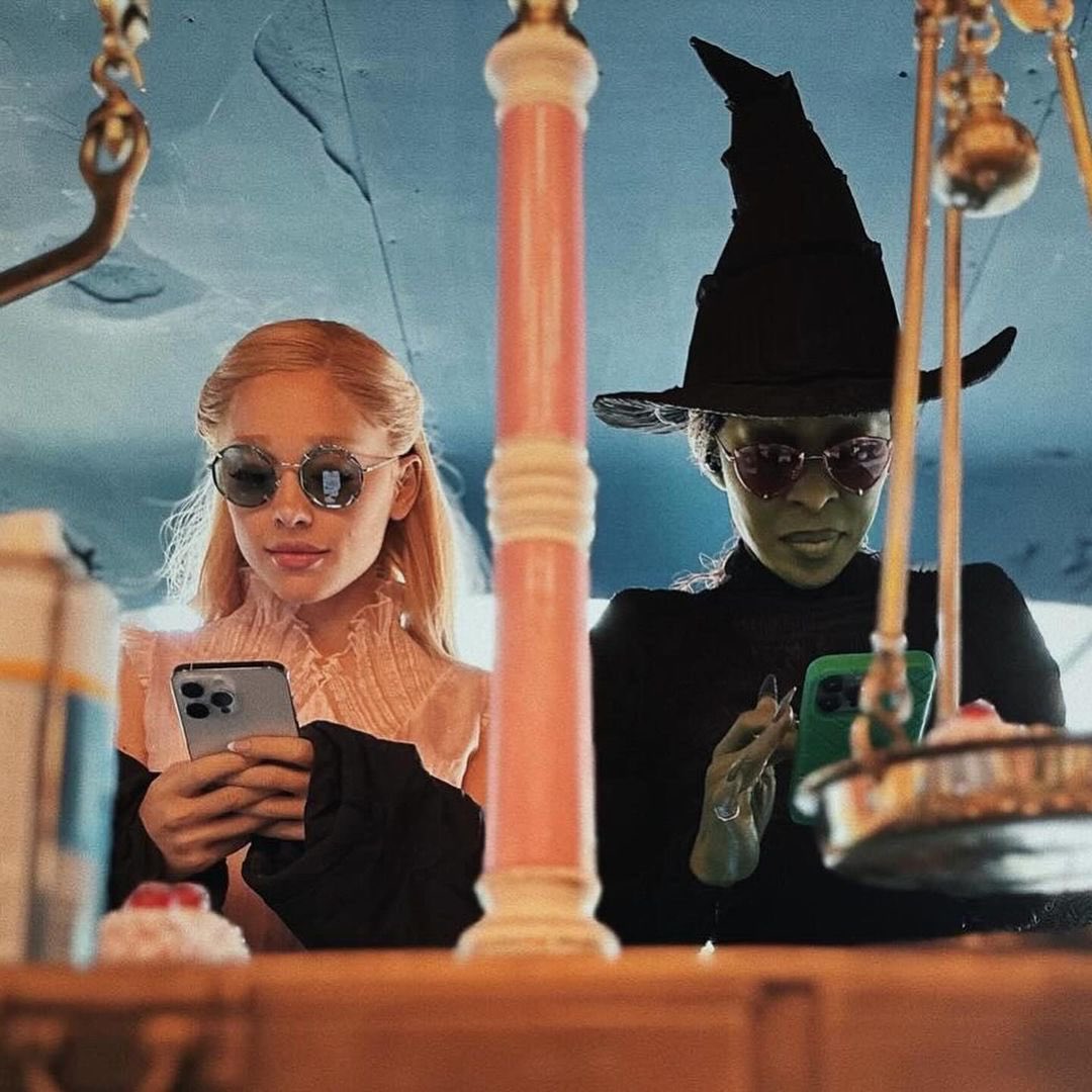 Ariana Grande shares new photos with Cynthia Erivo from the ‘Wicked’ set.