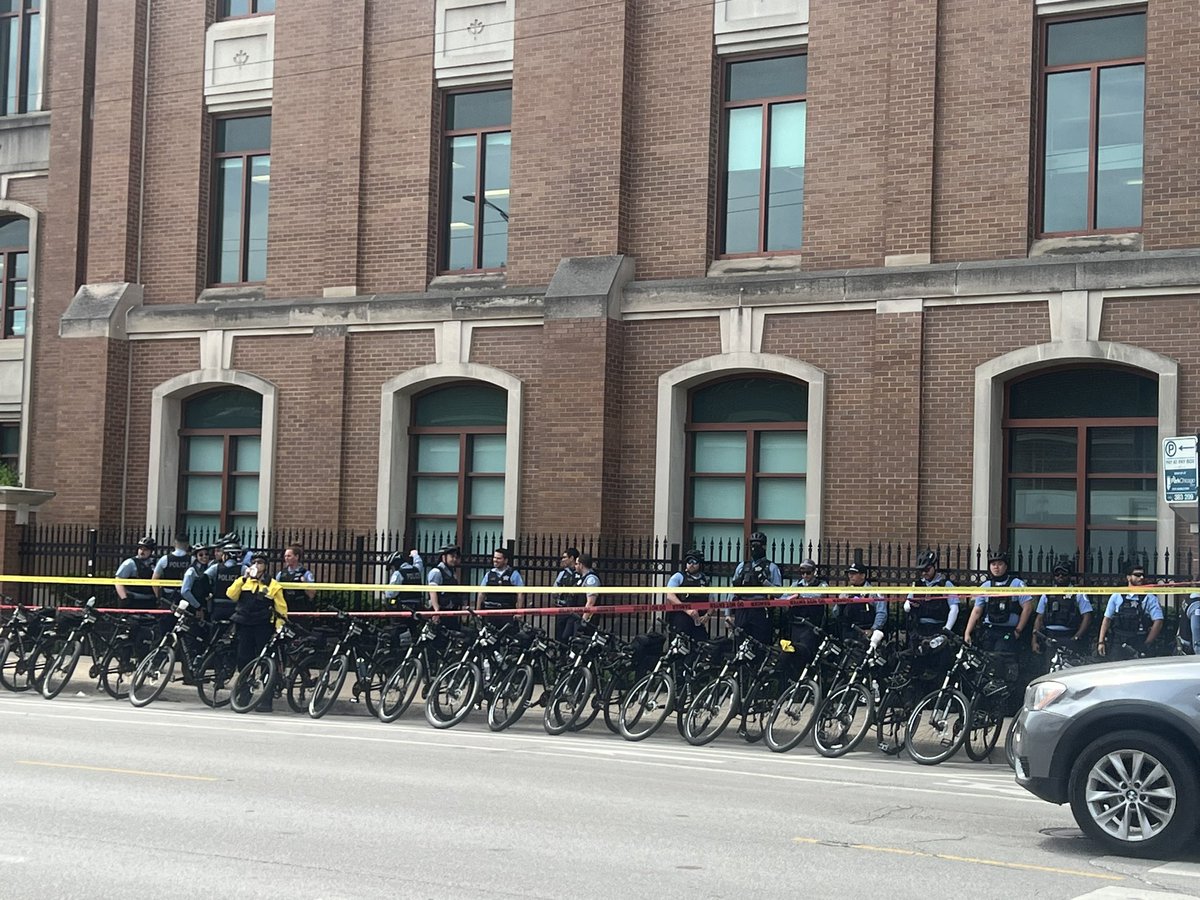 CPD continues to line up on the sidewalk next to the DePaul Quad. @14eastmag