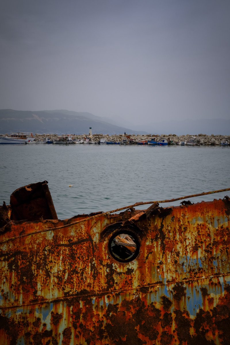 At the end of the beach was this harbour. A proper working harbour with fishing boats and part sunken boats, rusting slowly away. Albania Fuji XPro3