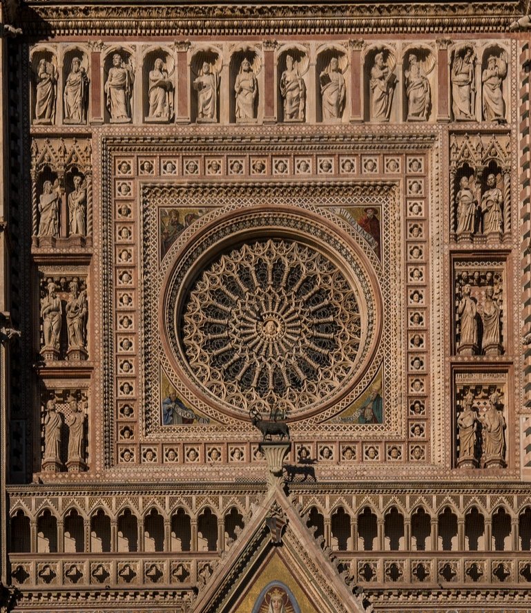 Debunk the myth that the Middle Ages was a dark and squalid period with a single image. I'll start, the rosette of Orvieto's Cathedral made by Andrea Orcagna: