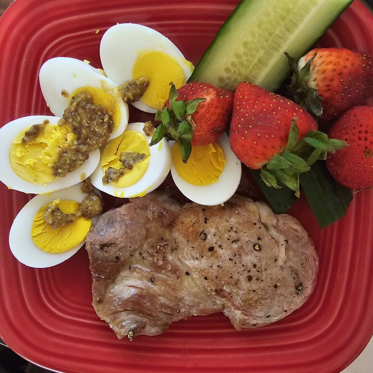 Pork sirloin with hard boiled eggs, and cucumber. 

My strawberries were going bad, I decided to use them up. 

(Also, your body is NOT a trash can, it's ok to let food go bad and throw it away)

#Ketoliving
#Ketovore
#lchf