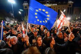 🇬🇪 🇺🇸 Georgia Revolt Paid for by the USA? Totally not foreign-sponsored Demonstrators in Tbilisi, Georgia, wave European Union flags and hold signs in English.

Fun Fact: Georgia, with a population of 3.7 million people, has 31,000 officially registered NGOs—that's one NGO for