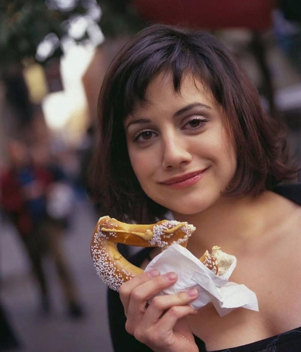 brittany murphy eating a pretzel, 1998.