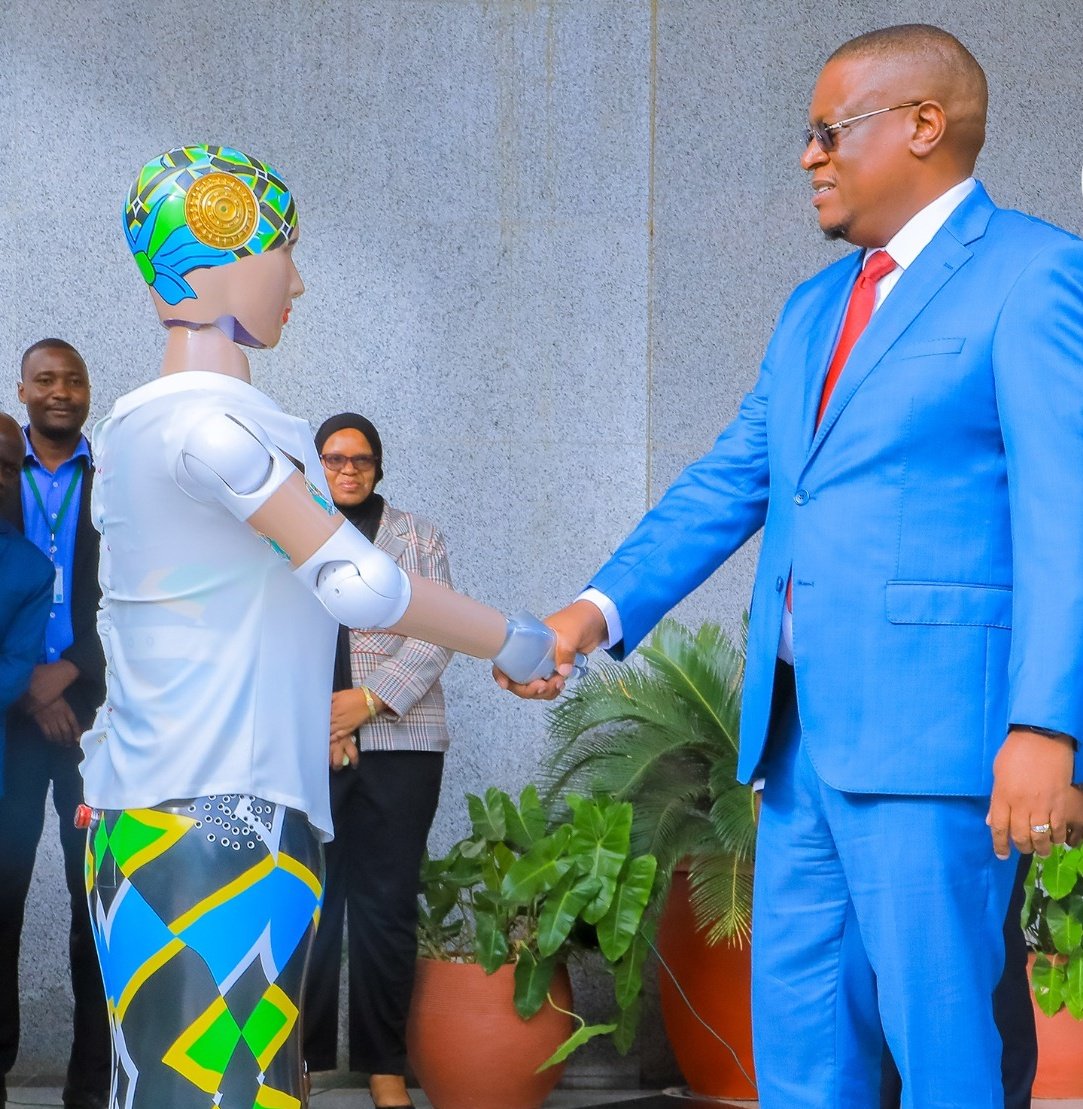 Tanzania's new robot, Eunice greeting ICT Minister Nape Nauye