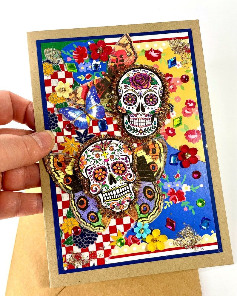 Handmade Sugar Skull Card With Dimensional Butterflies, Mixed Media Upcycled Collage Art, 5x7 - Etsy buff.ly/3V1dfmW #sugarskull #greetingcards