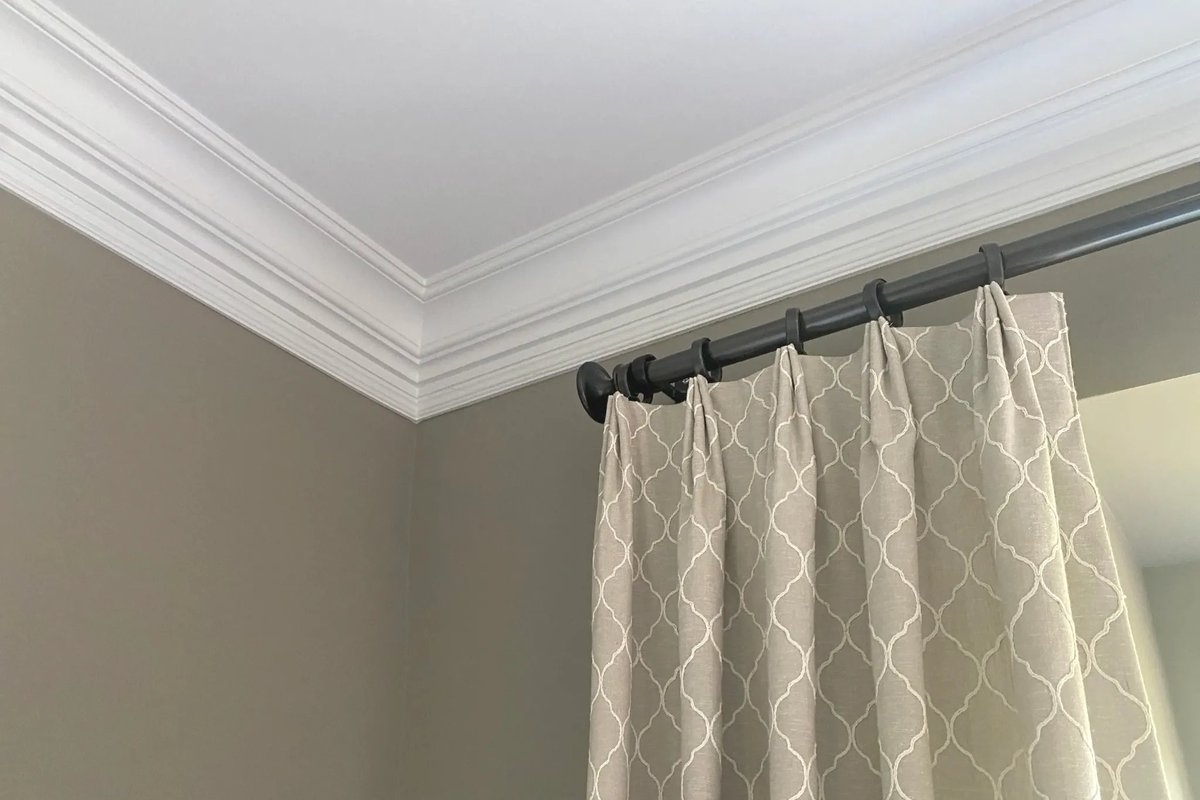 5 Crown Molding Styles for Your Home White crown molding joining a wall to the ceiling above a curtained window. #realtor #upgrade #remodel #teamhlmiami #refresh #realestate #diy #decoration