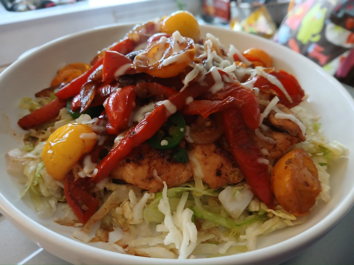 Chipotle chicken breasts with peppers, onions and jalapenos on shredded iceberg lettuce.  #twittersupperclub