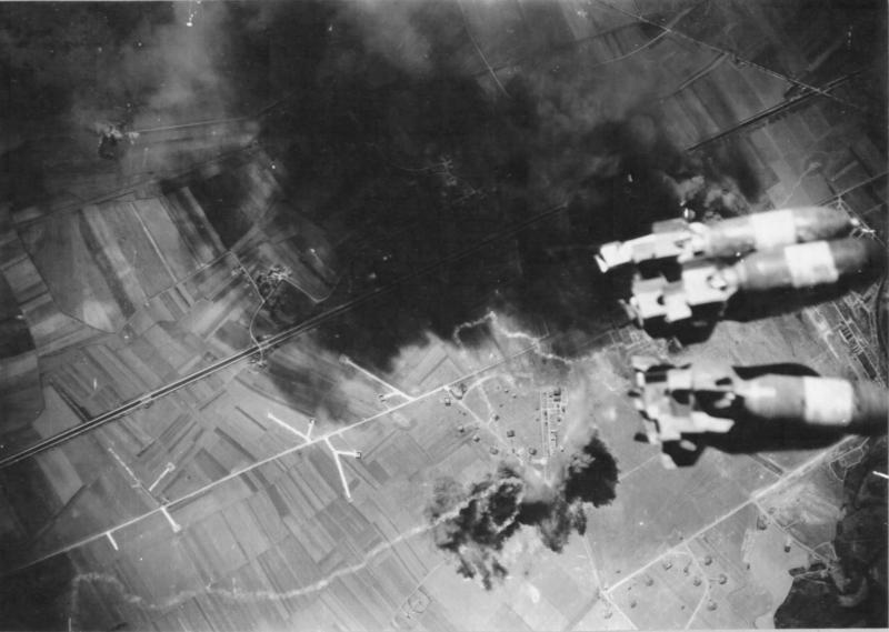 306th dropping bombs on an enemy airfield in France. #WWII