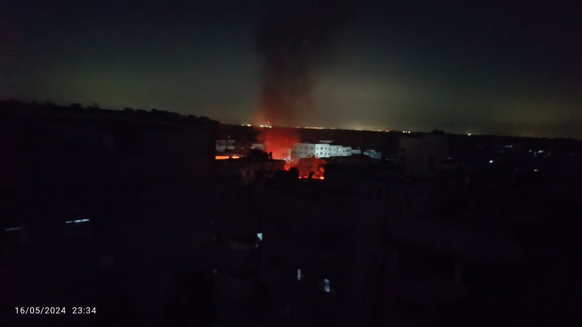 Breaking: The raging fire in the image is the result of an Israeli airstrike moments ago on the Al-Ja'ouni school, which shelters displaced people in the Nuseirat refugee camp in central Gaza. Israel has not yet satisfied its thirst for Palestinian blood. #GazaGenocide