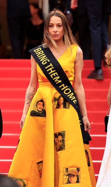 Nova Festival survivor makes powerful fashion statement at the Cannes Film Festival red carpet. Laura Blajman-Kadar wore a ‘Bring Them Home’ sash and a yellow dress featuring the faces of kidnapped Israelis who have been held hostage for 222 days.