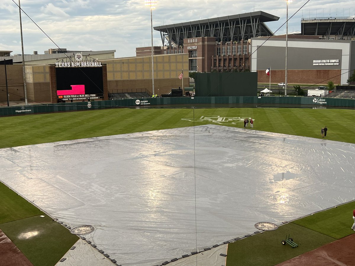 Jim Schlossnagle and Dave Van Horn are currently meeting with Nick McKenna (Assistant AD of Sports Fields) in shallow centerfield. The small lake behind them hasn’t subsided much.
