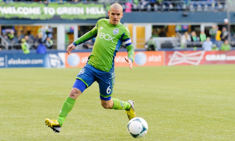 on notice laying the groundwork to a storied MLS career in Seattle. The Sounders faithful called on him as the “Honey Badger” due to his relentlessness in midfield. Don’t be fooled… he had the class to go forward as well, punishing opponents that granted him the freedom to have