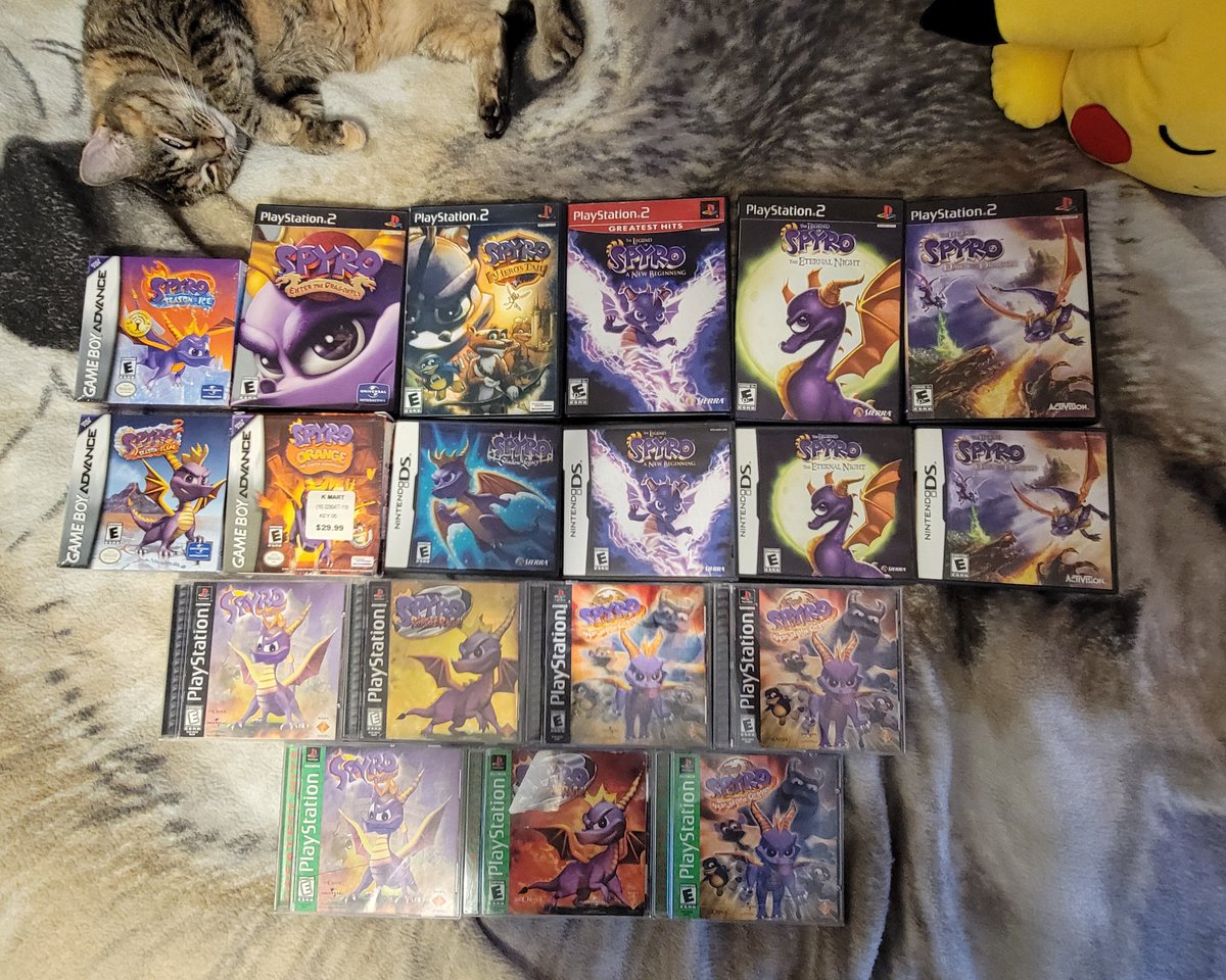 I managed to get pictures of my Spyro collection today. I have much more, but it's impossible to gather all of it into one place at the same time. More pictures will be added below as I take them.
(Suprise cat photobomb in the one photo)