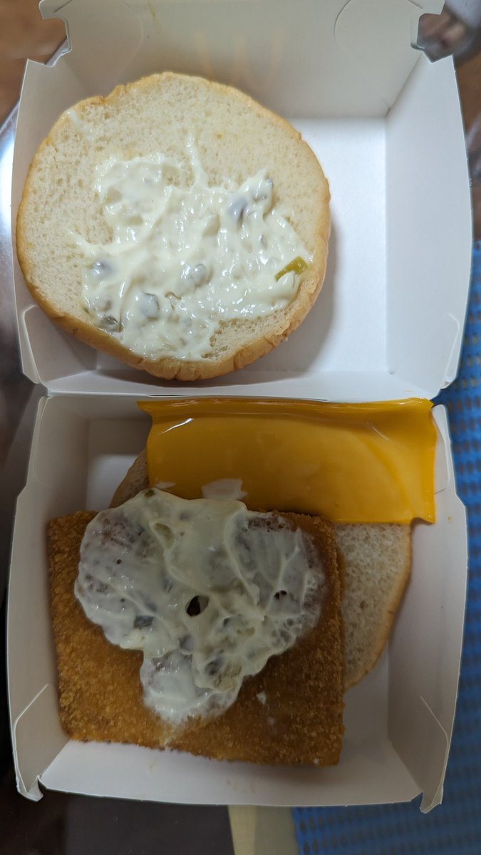 cheenweekiang's tweet photo. When they said "less is more," I didn't think they meant with the cheese on my burger. 🧀😂 Behold the epitome of generosity—a whole half slice of cheese! $Mcd https://t.co/taBpYeUDOU