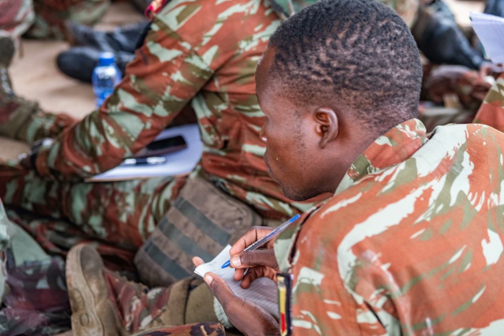 A Beninese Armed Forces Soldier takes notes during Improvised Explosive Device awareness training with led by members of U.S. Navy Special Operations Command and Belgian Special Operations Forces during #Flintlock24 at Daboya, Ghana, May 13, 2024.