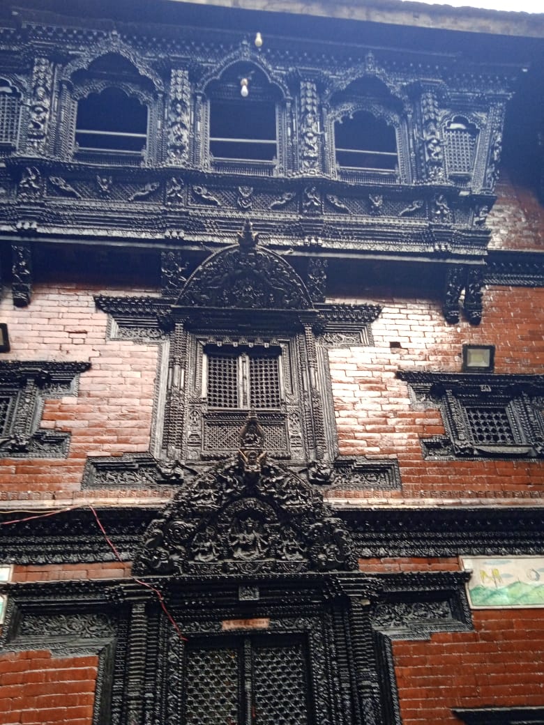 This is a prime example of Newari architecture in Kathmandu valley. The Newars are a community who are adherents of both Hinduism and Buddhism. They are mostly traders. Mostly Newar Hindus and Buddhists have existed peacefully for centuries.
