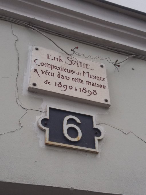 Erik SATIE was born on this day in 1866 This is his former home in Montmartre. Even though it was only a miniscule nine metre square closet it was big enough to fit his collection of 100 umbrellas, 2 pianos placed on top of each other and 12 identical corduroy suits!