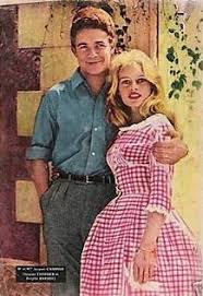 A charming story There are few memories more nostalgic for me than Mum's dressmaking: broderie anglaise trim, pearly belt buckles and always three yards width in the skirt. Already popular, gingham shot to fame in the '50s when Brigitte Bardot married in pretty pink checks.