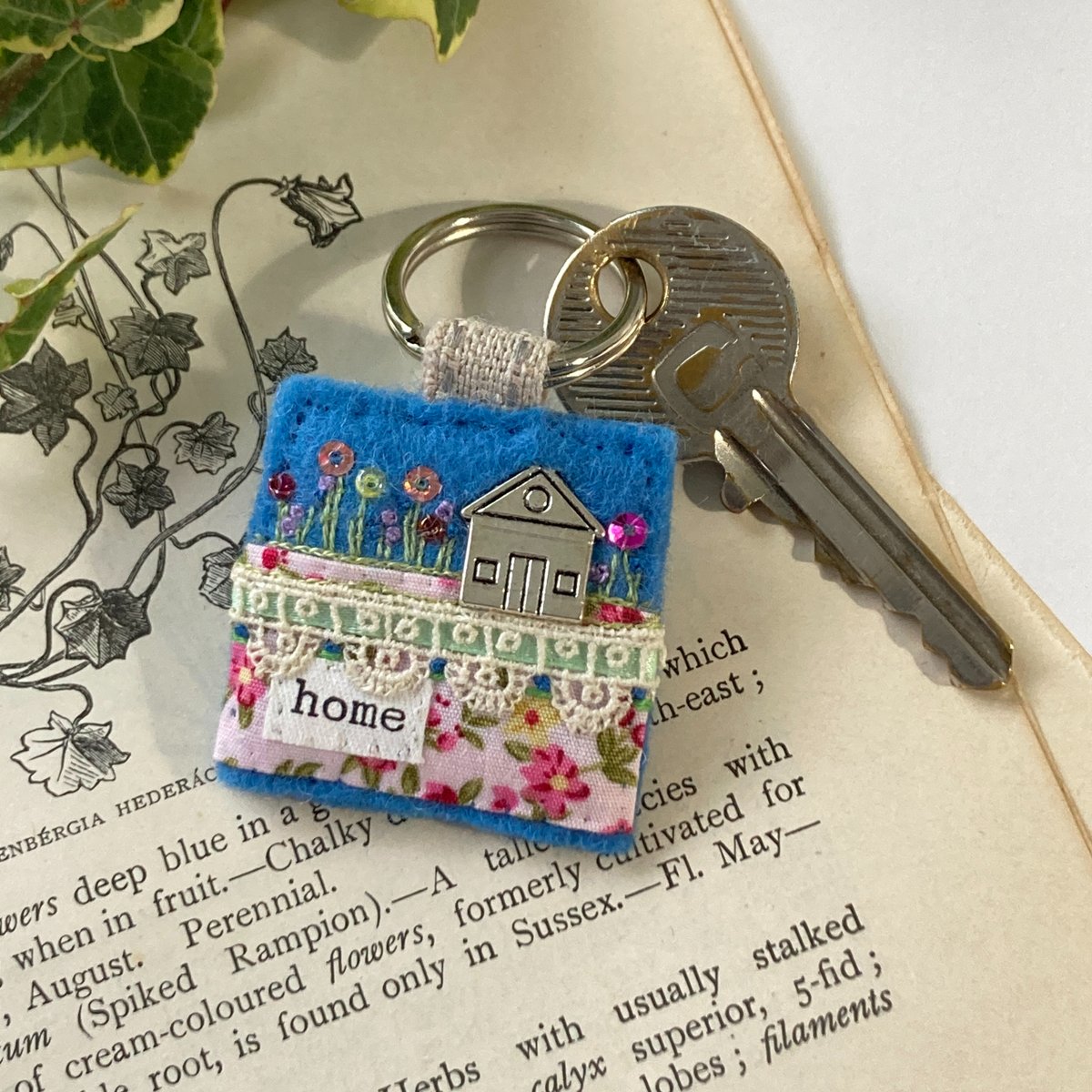 A unique little accessory for home owners. Hand sewn from mixed fabrics with trims and tiny embellishments, this house themed keyring would make a super housewarming gift for someone special. elliestreasures.square.site/product/house-… #EarlyBiz #newhome #movingday #handsewn #mhhsbd