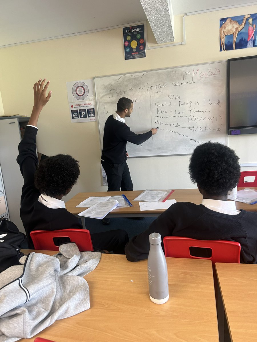 Today Year 11 are taking it in turns to deliver a short revision lesson for RE Paper 2. This is Yousif delivering the 5 roots of Usul ad-Din. A great way to revise together and keep learners engaged 😀 Well done Yousif! @LadybridgeHigh