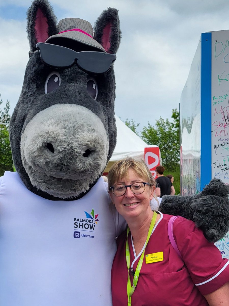Taking a break at the Balmoral Show. Helping out on the Cancer focus exhibition providing sun protection advice and free sun cream.