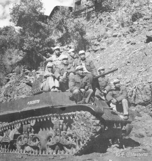 Chinese PLA Soldiers pose with a captured Indian tank. 1962 Sino-Indian War