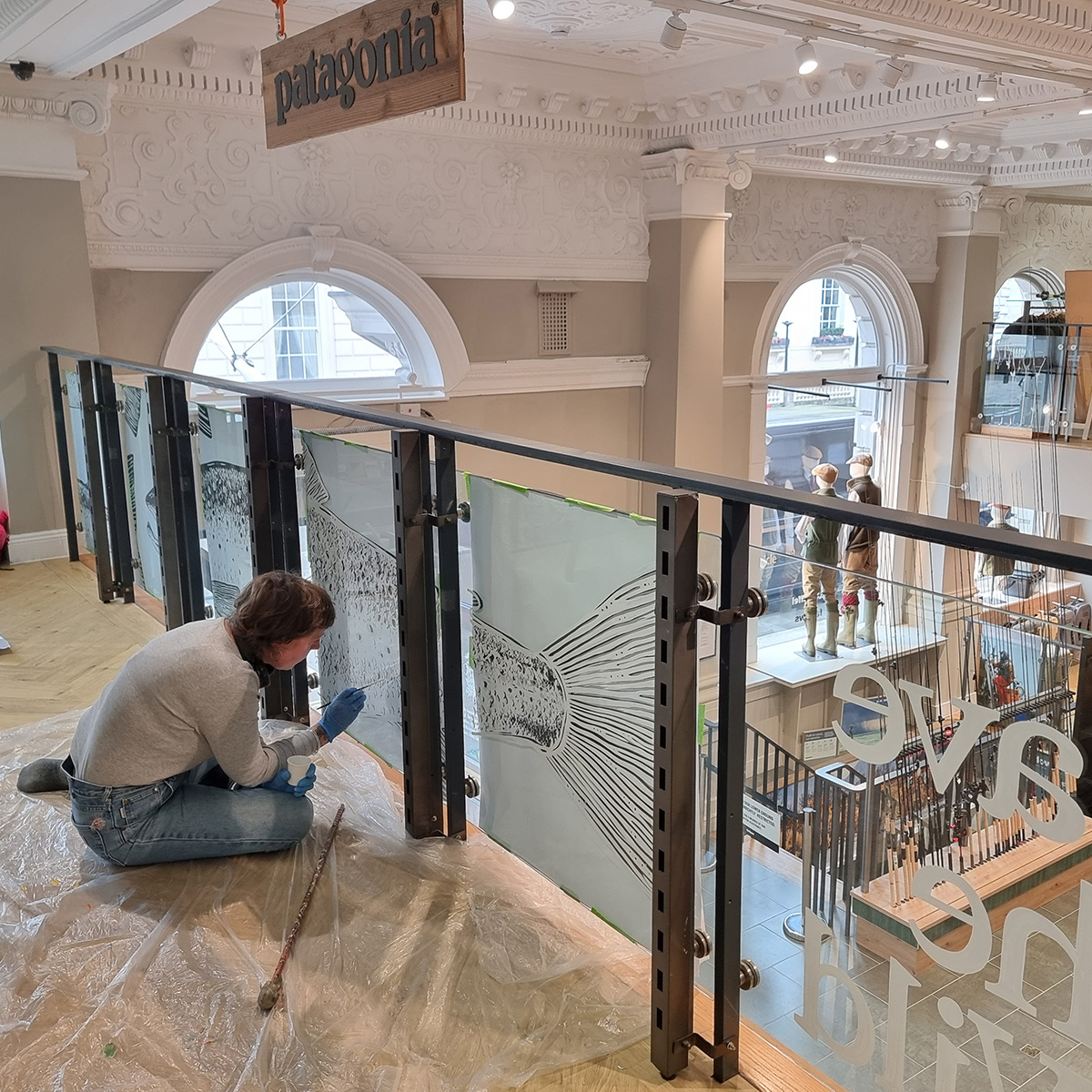 Our newly installed wild salmon artwork is hand-painted by Lorna Dunn. The mural took three days to complete and is located on the glass balustrade of our dedicated @patagoniaeurope mezzanine-level shop-in-shop. Come and see it for yourself! We’re open until 6pm today. #farlows