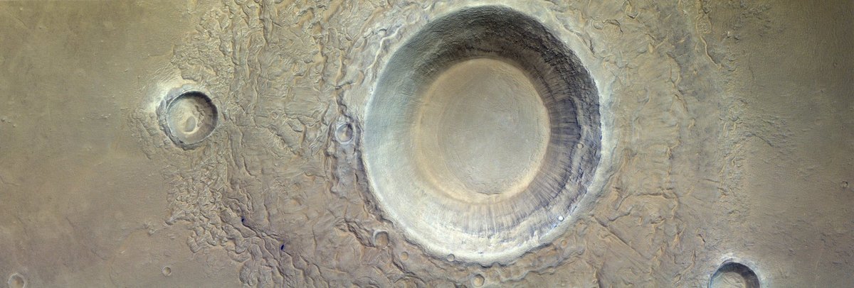 Massive Crater Discovered on Mars! This crater imaged by the ESO ExoMars spacecraft is one of the largest, possible THE largest in the solar system at ~3,300km wide. The impact that created this crater was so large that it may have played a role in transforming Mars from a water